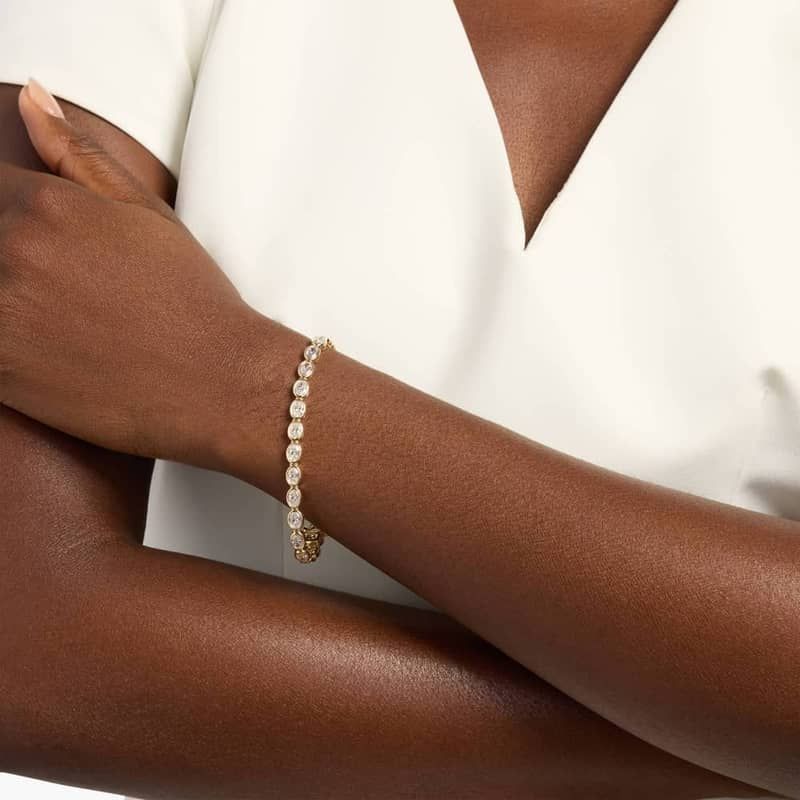 7 " Oval Cut Diamond E/W Bezel Set Tennis Bracelet In 14K Yellow Gold (10 Ct. tw. - H-I / SI1-SI2)